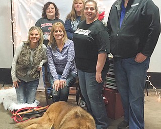SPECIAL TO THE VINDICATOR | The fourth annual Presents for Paws event was held on Dec. 5, 2015, and raised over $3,800 with a bake sale and basket auction featuring over 135 baskets. Several local animal rescues were present at the event, including Close to Home Animal Rescue, Friends of Fido, Paw Platoon Animal Rescue, Cats are People Too, Angels for Animals and Animal Pawtectors. All proceeds benefitted local rescue organizations. Event committee members included, front, from left, Melanie Mascioli, chairman; April Morris Prest, owner of Sit Means Sit; Melissa Simko; and event sponsor Ken Kemmer; and in back, Kathy Bukovinsky and Kate Haplea. Marlene Gerhardstein and Karla Farina Dooley also are committee members. The event featured free photos with Santa for pets of all sizes. Plans are being made for the 2016 event, set for Dec. 3 at Sit Means Sit, 1330 Seaborn St., Suite 6, Mineral Ridge. For information, find Presents for Paws on Facebook.