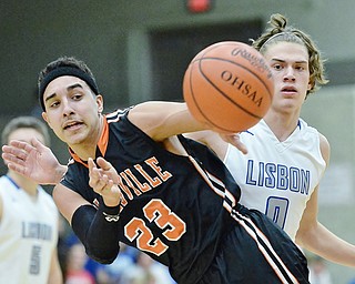 Jeff Lange | The Vindicator  TUE, MAR 1, 2016 - Wellsville's Mike Shope (23) makes a pass in front of Lisbon's Seth Stokes (0) late in the second half of Tuesday's DIV district semifinal in Struthers.