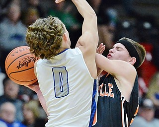 Jeff Lange | The Vindicator  TUE, MAR 1, 2016 - Wellsville's Jake Green (right) collides with Lisbon's Seth Stokes (0) while trying to make a pass late in the second half of their DIV district semifinal in Struthers on Tuesday.