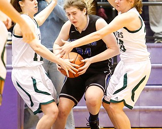 Elyria Catholic's Riley Schill (12) and Sam Filiaggi (20) guard Lakeview's Assie Becker (34) during their  Division II girls regional semifinal game at Barberton High School, Tuesday, March 1, 2016, in Barberton, Ohio. Elyria Catholic beat Lakeview 50-44. Alex Slitz for The Vindicator