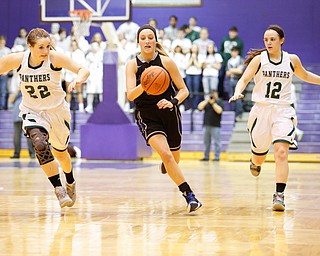 Lakeview's Jensen Silbaugh (5) drives down court past Elyria Catholic's Nora Hopkins (22) And Riley Schill (12) during their  Division II girls regional semifinal game at Barberton High School, Tuesday, March 1, 2016, in Barberton, Ohio. Elyria Catholic beat Lakeview 50-44. Alex Slitz for The Vindicator