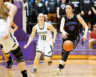 Lakeview's Annie Pavlansky (10) drives past Elyria Catholic's Regan Schill (10) during their  Division II girls regional semifinal game at Barberton High School, Tuesday, March 1, 2016, in Barberton, Ohio. Elyria Catholic beat Lakeview 50-44. Alex Slitz for The Vindicator
