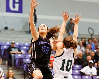 Lakeview's Lindsay Carnahan (20) shoot past Elyria Catholic's Regan Schill (10) during their  Division II girls regional semifinal game at Barberton High School, Tuesday, March 1, 2016, in Barberton, Ohio. Elyria Catholic beat Lakeview 50-44. Alex Slitz for The Vindicator