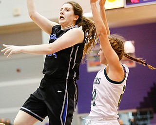 Lakeview's Addie Becker (34) shoots past Elyria Catholic's  Sam Filiaggi (20) during their Division II girls regional semifinal game at Barberton High School, Tuesday, March 1, 2016, in Barberton, Ohio. Elyria Catholic beat Lakeview 50-44. Alex Slitz for The Vindicator