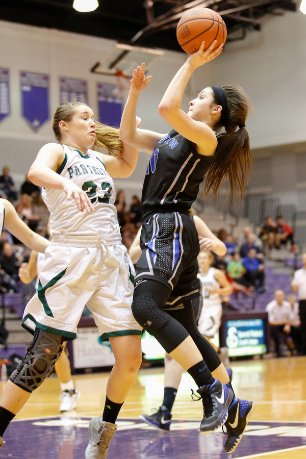 Lakeview's Annie Pavlansky (10) goes to the hoop against Elyria Catholic's Nora Hopkins (22) during their  Division II girls regional semifinal game at Barberton High School, Tuesday, March 1, 2016, in Barberton, Ohio. Elyria Catholic beat Lakeview 50-44. Alex Slitz for The Vindicator