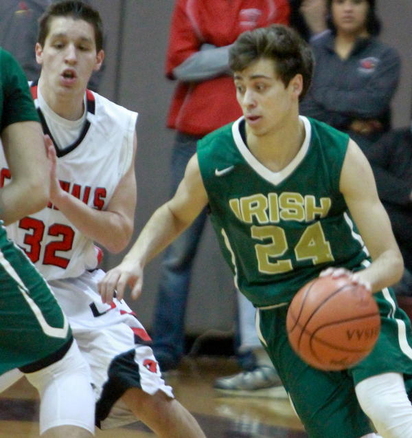 William d lewis the vindicator  Ursuline Greg Pzrella(24) drives around Canfield's Julian Vitto(32).