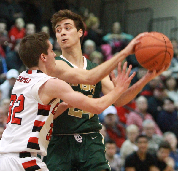 William d lewis the vindicator  Ursuline Greg Pzrella(24) keeps the ball from Canfield's Julian Vitto(32).