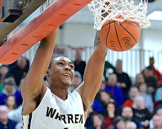 Jeff Lange | The Vindicator  WED, MAR 2, 2016 - Warren G. Harding's Derek Culver watches as he slams the ball through the hoop for two late in the second half of the Raiders' DI district semifinal against Louisville Wednesday night at Alliance High School.