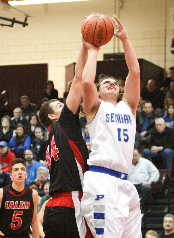 william D. LewisThe Vindicator Poland's NickBuccieri(15) shoots past Salem's Joe rusyn(44).
