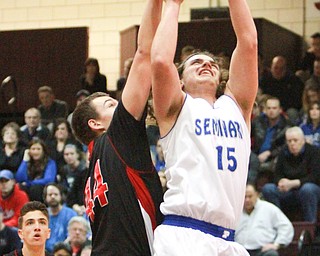 william D. LewisThe Vindicator Poland's NickBuccieri(15) shoots past Salem's Joe rusyn(44).
