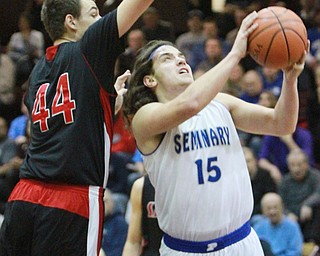 william D. LewisThe Vindicator Poland's NickBuccieri(15) shoots past Salem's Joe rusyn(44).
