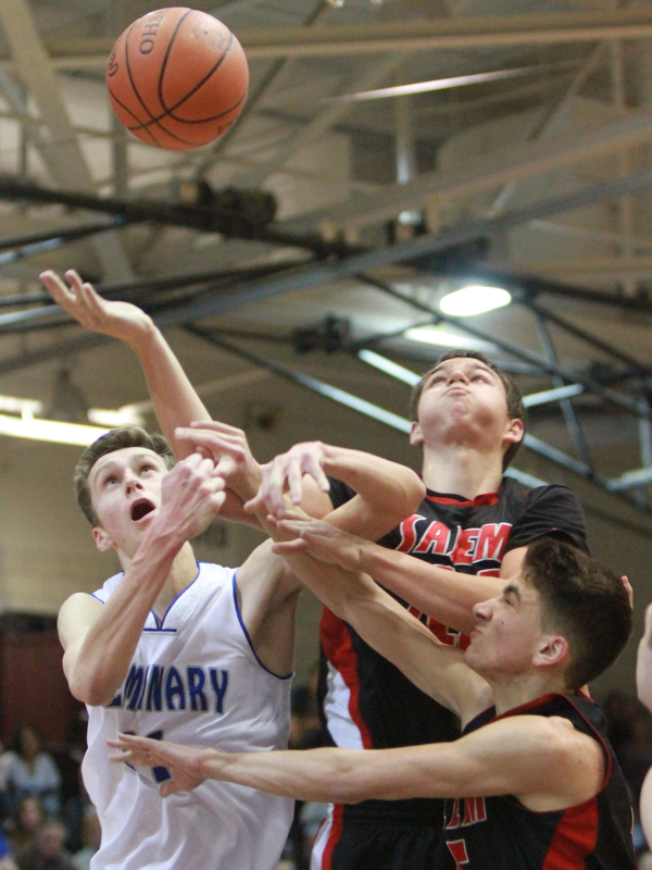 William D Lewis The Vindicator Poland's Matt Baker(11) andSalems Nick Rusyn(11) and Jon Gerace(5) go for a rebound.