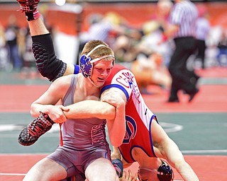 COLUMBUS, OHIO - MARCH 3, 2016: Dante Ginnetti of Poland controls the leg of Nick Berry of Dayton Carroll as he puts him in a awkward position during their 120lb Division II championship bracket bout Thursday night at Schottenstein Center. DAVID DERMER | THE VINDICATOR