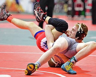 COLUMBUS, OHIO - MARCH 3, 2016: Nick Berry of Dayton Carroll looks up while being rolled over onto his back by Dante Ginnetti of Poland during their 120lb Division II championship bracket bout Thursday night at Schottenstein Center. DAVID DERMER | THE VINDICATOR