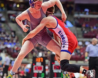 COLUMBUS, OHIO - MARCH 3, 2016: Dante Ginnetti of Poland stuffs a takedown attempt by Nick Berry of Dayton Carroll during their 120lb Division II championship bracket bout Thursday night at Schottenstein Center. DAVID DERMER | THE VINDICATOR