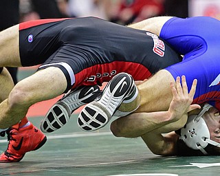 COLUMBUS, OHIO - MARCH 3, 2016: C.J. Frost of Canfield props himself up after being takedown briefly by Cole Woods of Millersburg West Holmes during their 138lb Division II championship bracket bout Thursday night at Schottenstein Center. DAVID DERMER | THE VINDICATOR
