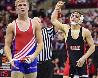 COLUMBUS, OHIO - MARCH 3, 2016: C.J. Frost of Canfield has his arm raised in victory after defeating Cole Woods of Millersburg West Holmes after their 138lb Division II championship bracket bout Thursday night at Schottenstein Center. DAVID DERMER | THE VINDICATOR