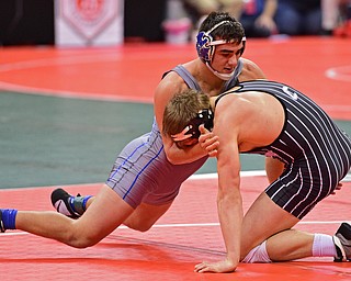 COLUMBUS, OHIO - MARCH 3, 2016: Anthony Audi of Poland sprawls to prevent a takedown attempt from Aidan Pasiuk of Carrollton during their 170lb Division II championship bracket bout Thursday night at Schottenstein Center. DAVID DERMER | THE VINDICATOR..