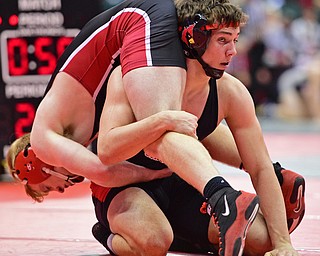 COLUMBUS, OHIO - MARCH 3, 2016: David Crawford of Canfield looks to his corner for advice while Gunnar Dawson of Middletown Madison rides his back during their 160lb Division II championship bracket bout Thursday night at Schottenstein Center. DAVID DERMER | THE VINDICATOR..