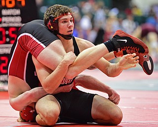 COLUMBUS, OHIO - MARCH 3, 2016: David Crawford of Canfield looks to his corner for advice while Gunnar Dawson of Middletown Madison rides his back during their 160lb Division II championship bracket bout Thursday night at Schottenstein Center. DAVID DERMER | THE VINDICATOR..