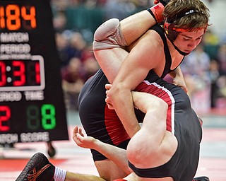 COLUMBUS, OHIO - MARCH 3, 2016: David Crawford of Canfield attempts to work Gunnar Dawson of Middletown shoulders down to the mat during their 160lb Division II championship bracket bout Thursday night at Schottenstein Center. DAVID DERMER | THE VINDICATOR.
