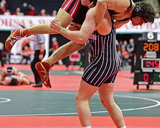 COLUMBUS, OHIO - MARCH 3, 2016: Ben Norman of Girard holds onto the body of Brody Robinson before being slammed to the mat during their 220lb Division II championship bracket bout Thursday night at Schottenstein Center. DAVID DERMER | THE VINDICATOR.