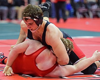 COLUMBUS, OHIO - MARCH 3, 2016: Jacob Esarco of Canfield attempts to work the shoulders of Logan Ford of down to the mat during their 220lb Division II championship bracket bout Thursday night at Schottenstein Center. DAVID DERMER | THE VINDICATOR..