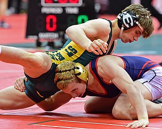 COLUMBUS, OHIO - MARCH 3, 2016: Andrew Fairbanks of Fitch holds on to the leg of Sam Dover of St. Edward in an attempt to prevent him from taking control of his back during their 132lb Division I championship bracket bout Thursday night at Schottenstein Center. DAVID DERMER | THE VINDICATOR.