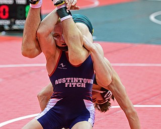 COLUMBUS, OHIO - MARCH 3, 2016: Andrew Fairbanks of Fitch attempts to work out of a awkward position while Sam Dover of St. Edward has his legs wrapped around his head during their 132lb Division I championship bracket bout Thursday night at Schottenstein Center. DAVID DERMER | THE VINDICATOR.
