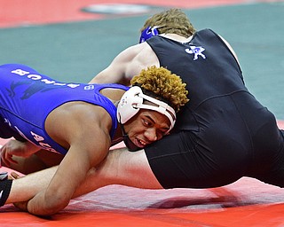 COLUMBUS, OHIO - MARCH 3, 2016: Isiah Jackson of Fitch holds on to the leg of Alec Forrer of Grafton Midview during their 170lb Division I championship bracket bout Thursday night at Schottenstein Center. DAVID DERMER | THE VINDICATOR