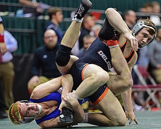 COLUMBUS, OHIO - MARCH 3, 2016: Adam Green of Fitch holds on to the leg of Max Wright of Delaware Hayes while he holds on to his leg during their 160lb Division I championship bracket bout Thursday night at Schottenstein Center. DAVID DERMER | THE VINDICATOR