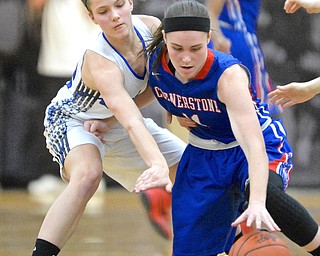 Jeff Lange | The Vindicator  THU, MAR 3, 2016 - Jackson-Milton's Michaelina Terranova (left) knocks the ball away from Cornerstone's Jordan Cloonan in the first half of Thursday night's game in Massillon.