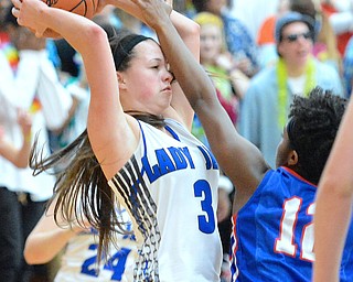 Jeff Lange | The Vindicator  THU, MAR 3, 2016 - Lady Jays' Emily Williams (3) is hit in the face by Cornerstone's Mickayla Baldwin in the first half of Thursday night's game in Massillon.