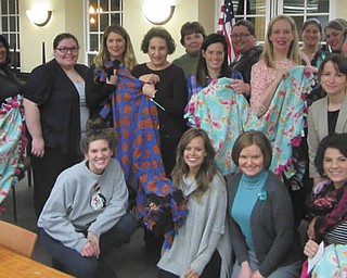 SPECIAL TO THE VINDICATOR | The Junior League of Youngstown’s general membership meeting took place recently at the Poland Library. Guest speakers Jana Coffin and Colleen Eisenbraun of the local nonprofit Making Kids Count shared information about their mission. A group of league members assisted MKC by making no-sew blankets that will be donated to foster children. They included, front, from left, Paige Rassega, Lindsey Bickerstaff, Jennifer Soloman and Leanna Kemble; and, standing, Kera Simmons, Cheryl McArthur, Arista Coleman, Marion Dunham, Deb Hartig, Mercia Stevens, Sara Wenger, Liz Kijowski, Amy Banks, Kristina Ross Pavlicko, Maggie Matune, Kristina Miller, Kim Urig and Heather Elder. The league’s next meeting is set for 6 p.m. Tuesday at the Girard Multi-Generational Center, 443 Trumbull Ave. For information about the leadership experience and volunteer opportunities provided by the league, email juniorleagueofyoungstown@gmail.com, call 330-740-3200 or visit www.jlyoungstown.org.