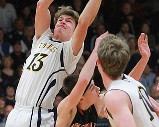William d Lewis the Vindicator  McDonald's Dylan Portolese(13) pulls down a rebound past Wellsville's Jake Green(0).  McDonald defeated wellsvile 3-4-16 at Struthers.