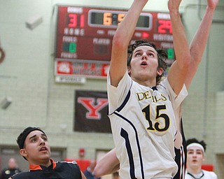 William d Lewis the Vindicator  McDonald's  Jake Reckard(15) goes for 2 past Wellsville's Mike shope(23). McDonald defeated wellsvile 3-4-16 at Struthers.