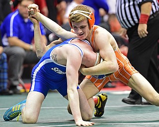 COLUMBUS, OHIO - MARCH 4, 2016: Tyler Warner of Claymont bends the arm of Dante Gannett of Poland while controlling his head and neck during their 120lb  Division II championship bracket bout Friday afternoon at Schottenstein Center. DAVID DERMER | THE VINDICATOR
