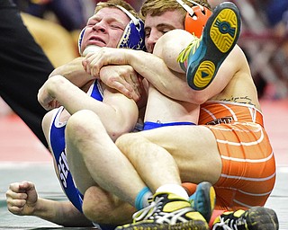 COLUMBUS, OHIO - MARCH 4, 2016: Dante Gannett of Poland is squeezed into a uncomfortable position by Tyler Warner of Claymont during their 120lb  Division II championship bracket bout Friday afternoon at Schottenstein Center. DAVID DERMER | THE VINDICATOR