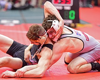 COLUMBUS, OHIO - MARCH 4, 2016: C.J. Frost of Canfield controls the back of Greg Briggs of Cloverleaf while he attempts to break free from the bottom during their 138lb Division II championship bracket bout Friday afternoon at Schottenstein Center. DAVID DERMER | THE VINDICATOR