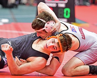 COLUMBUS, OHIO - MARCH 4, 2016: C.J. Frost of Canfield controls the back of Greg Briggs of Cloverleaf while he attempts to break free from the bottom during their 138lb Division II championship bracket bout Friday afternoon at Schottenstein Center. DAVID DERMER | THE VINDICATOR