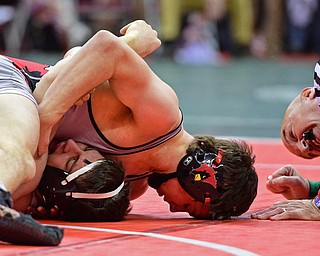 COLUMBUS, OHIO - MARCH 4, 2016: David Crawford of Canfield word to pin Noah Clary of Upper Sandusky to the mat during their 160lb Division II championship bracket bout Friday afternoon at Schottenstein Center. DAVID DERMER | THE VINDICATOR