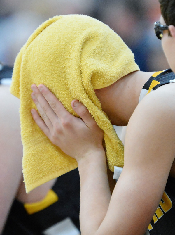Jeff Lange | The Vindicator  FRI, MAR 4, 2016 - A Garrettsville Garfield player hides his face under his towel after a 34-31 loss to Newton Falls in the DIII district championship game at Warren Harding High School Friday night.