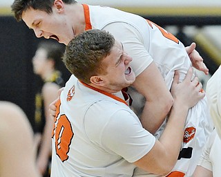 Jeff Lange | The Vindicator  FRI, MAR 4, 2016 - In celebration of their 34-31 win over Garrettsville Garfield, Newton Falls' Ben Koonts (bottom) lifts teammate Alan Boone over his shoulder Friday night in Warren.