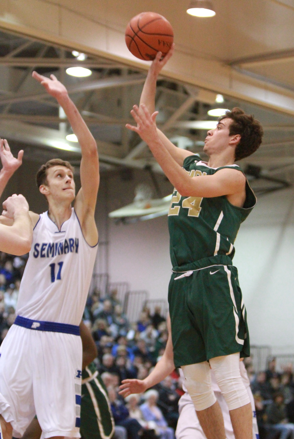 William d Lewis the vindicator  Ursuline's Greg Parella(24) shoots overPoland's Matt Baker(11).