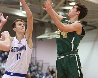 William d Lewis the vindicator  Ursuline's Greg Parella(24) shoots overPoland's Matt Baker(11).