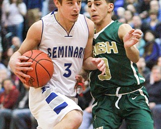William d Lewis the vindicator Poland's Mike Gajdos(3) drives around Ursuline's anise algahmee(3) .