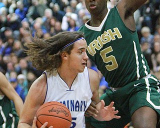 William d Lewis the vindicator  Poland's NickBuccieri(15 drives around Ursuline's Anthony howell(5).