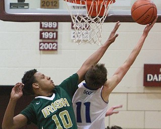William d Lewis the vindicator Ursuline's Devin Hardin(10) defends against Poland's Matt Baker(10).