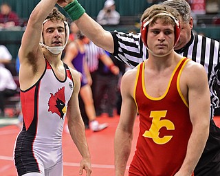 COLUMBUS, OHIO - MARCH 5, 2016: C.J. Frost of Canfield has his arm raised in victory after defeating Miles Mazik of Indian Valley to move onto the 3rd place bout after their 138lb  Division II consolation bracket bout Saturday morning at Schottenstein Center. DAVID DERMER | THE VINDICATOR