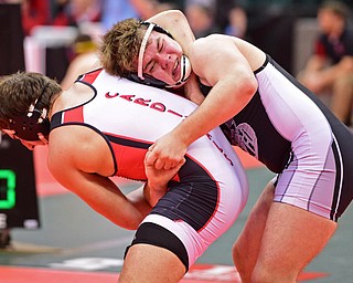 COLUMBUS, OHIO - MARCH 5, 2016: Johnny Shafer of St. Paris Graham Local attempts to hold onto the body of Jacob Esarco of Canfield while he applies pressure to the neck of him during their 220lb Division II consolation bracket bout Saturday morning at Schottenstein Center. DAVID DERMER | THE VINDICATOR